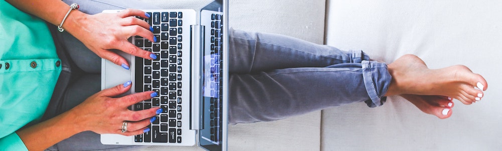 A woman searches for free samples on her laptop.